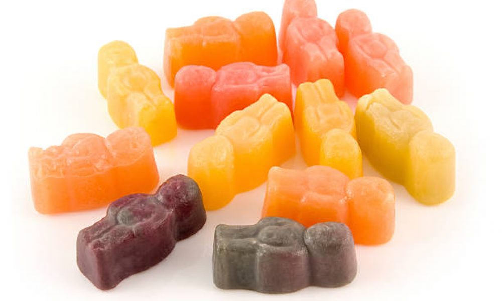 Jelly baby sweets on a white background.